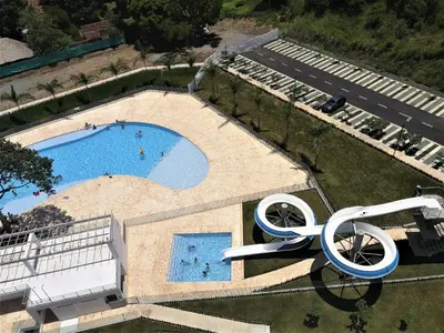an overhead view of a swimming pool with a sculpture at Acogedor, Gran Vista a las Montañas y a la Ciudad! in Santa Fe de Antioquia