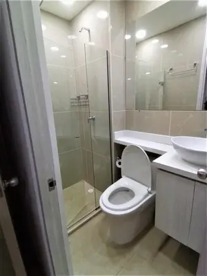 a bathroom with a toilet and a sink and a shower at Acogedor, Gran Vista a las Montañas y a la Ciudad! in Santa Fe de Antioquia