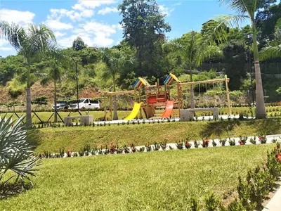 a playground in a park with a playground at Acogedor, Gran Vista a las Montañas y a la Ciudad! in Santa Fe de Antioquia