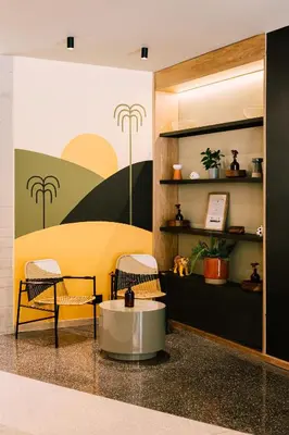 a waiting room with two chairs and a table at The Somos Bold Hotel in Medellín