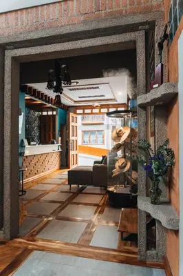 a living room with a couch and a table at Hotel Entre Brumas in Aguadas