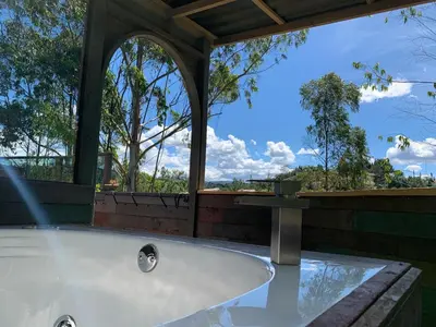 a jacuzzi tub in a house with a view at PrivaDome in Rionegro