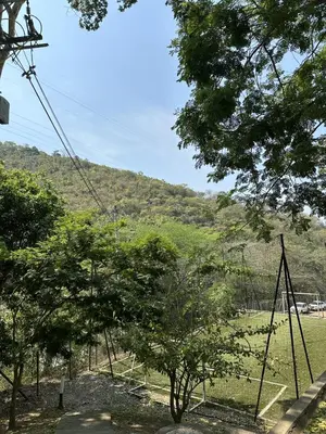 a swing set in a field with trees at Edén de Alejo - Apartamento - Lujo y Confort en San Jerónimo in San Jerónimo