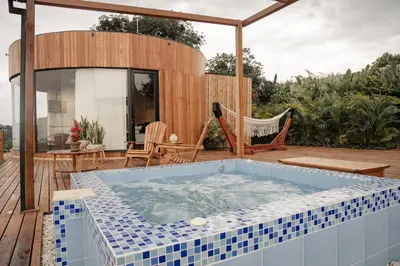 a hot tub on the deck of a house at Atardeceres del Cafe in Manizales