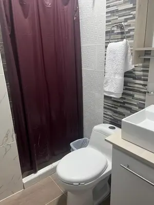 a bathroom with a toilet and a shower at Hotel RIO Y SOL DORADO in La Dorada