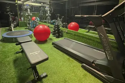 a gym with a treadmill and exercise equipment on the floor at 4 Sur Hotel in Medellín