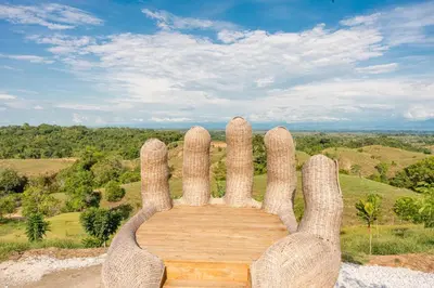 a statue of a hand held up in the air at Hotel Piedra Mulata - Adults Only in Doradal