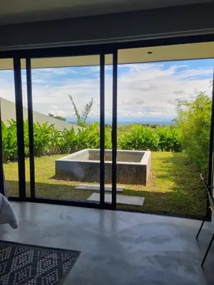 a view from inside a house looking out onto a garden at Hotel Piedra Mulata - Adults Only in Doradal