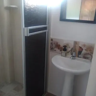 a small bathroom with a sink and a mirror at Casa Hotel Castellón in Hispania