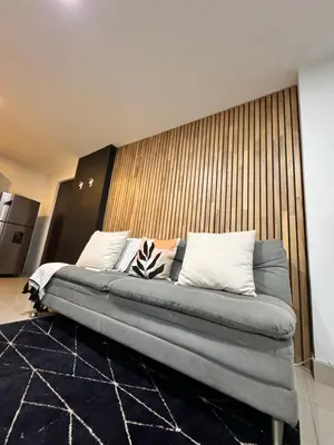 a large bed in a room with a wall at 1208 Beautiful apartment, exclusive area in the poblado in Medellín