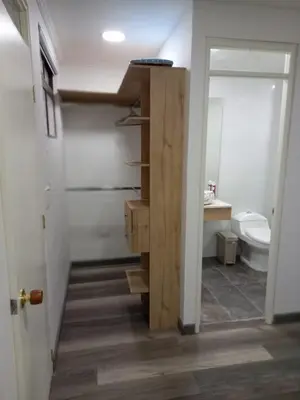 a bathroom with a sink and a toilet in a room at Hermoso apartamento Medellín in Medellín