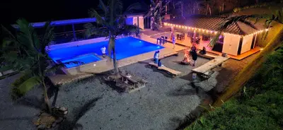 an overhead view of a swimming pool at night at La escondida in Guarne