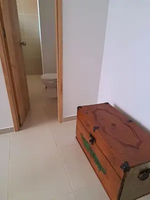 a wooden box sitting in a bathroom with a toilet at Aparta Hotel Jardines de Guatape By Hope in Guatapé