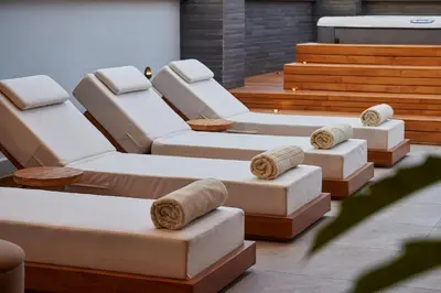a group of couches and chairs in a room at Hotel Selis in Medellín