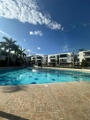 a large swimming pool in front of some buildings at Apartasol privado Santa Fe de Antioquia in Santa Fe de Antioquia
