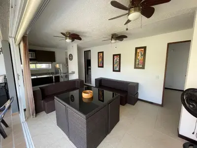 a living room with a couch and a table at Apartasol privado Santa Fe de Antioquia in Santa Fe de Antioquia