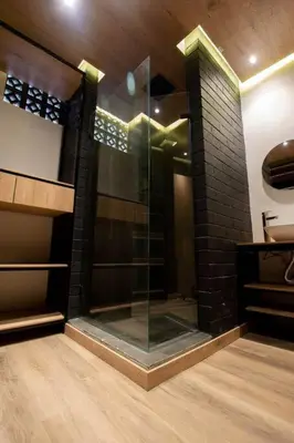 a glass shower in the middle of a room at Deluxe Man cave with jacuzzy in Envigado