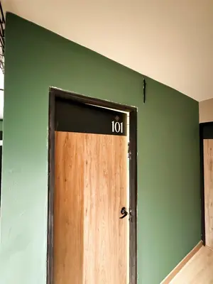 a door with a sign on it in a room at Nuevo estudio cerca de Plaza Mayor NID101 By Roots Rentals in Medellín