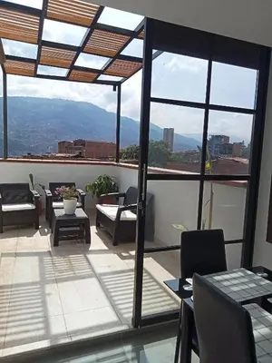 a balcony with a view of the mountains at nuevo amanecer in Bello