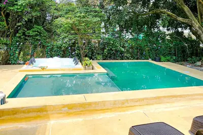 a swimming pool in a backyard with at Luxury Home In Aguacatala in Medellín