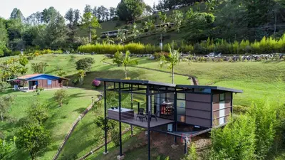 an aerial view of a tiny house in a field at Marina Navegar in Guatapé