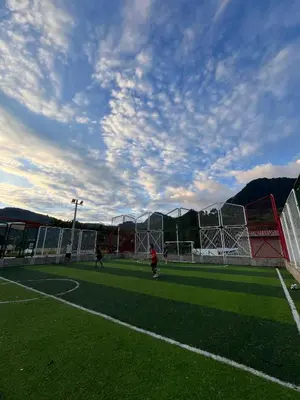 a group of people playing soccer on a soccer field at Magic Jardín Hostel - Patio, Balcony & Rooftop in Jardin