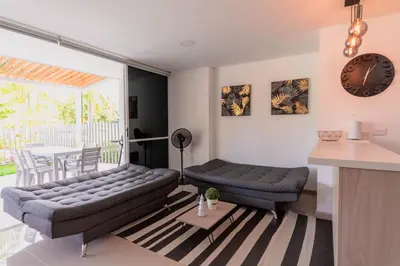 a living room with a couch and a table at Apartasol Dominica Citadela Di Sole in Santa Fe de Antioquia