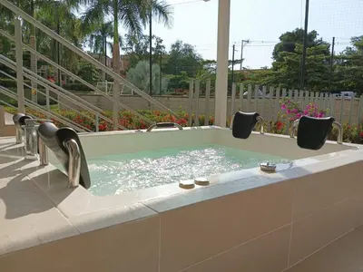 a jacuzzi tub with two faucets at Apartasol Dominica Citadela Di Sole in Santa Fe de Antioquia