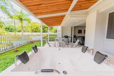 a large white tub in the middle of a yard at Apartasol Dominica Citadela Di Sole in Santa Fe de Antioquia
