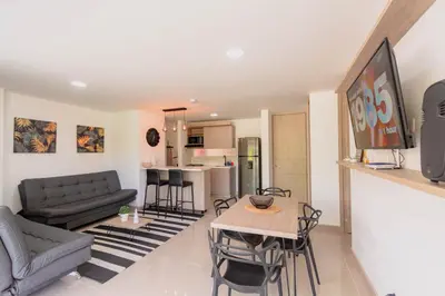 a living room with a couch and a table at Apartasol Dominica Citadela Di Sole in Santa Fe de Antioquia