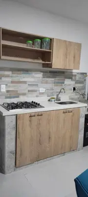 a kitchen with a sink and a counter top at 23 BELO APARTAMENTO CON BALCON EN LAURELES ESTADiO 2 HAB 2 BAÑOs in Medellín