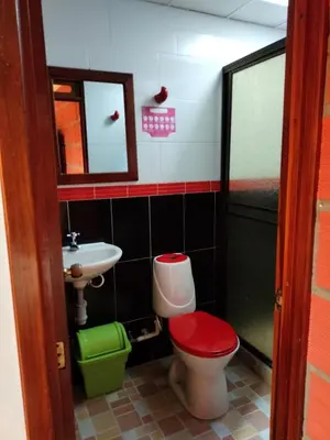 a bathroom with a toilet and a sink at Casa Hotel Los Faroles- Samaná/Caldas in Samaná