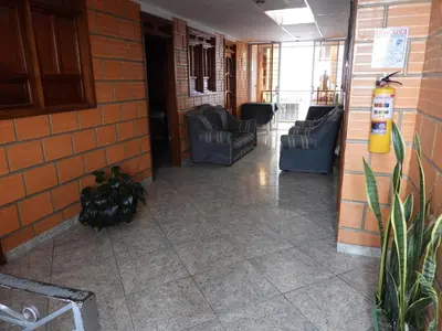 a lobby with two chairs at Casa Hotel Los Faroles- Samaná/Caldas in Samaná