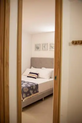 a bedroom with a bed in a room at Apartamento Duplex - Aqua Guatape in Guatapé