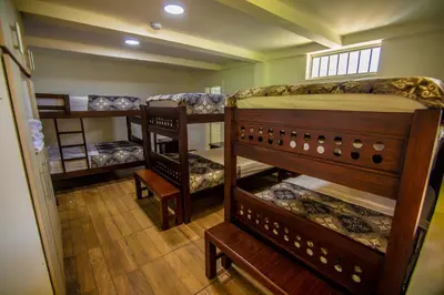 a group of bunk beds in a room at Hotel Terra Belén in Belén de Umbría