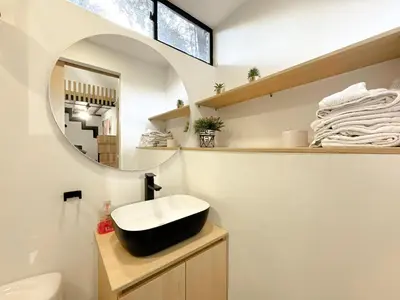a bathroom with a black sink and a mirror at Mini Casa en Poblado Medellín FRN109 By Roots Rentals in Medellín