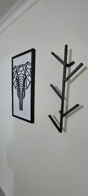 a picture of an elephant on a wall next to a cross at Luxury Loft Shakespeare in Medellín