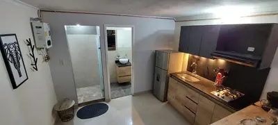 a small bathroom with a shower and a sink at Luxury Loft Shakespeare in Medellín