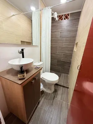 a bathroom with a sink and a toilet at Maravilla de cabaña grupal 5-10 personas parking, wifi, campestre, cercana in Jardin