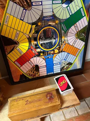 a board game with a picture of a building at Maravilla de cabaña grupal 5-10 personas parking, wifi, campestre, cercana in Jardin