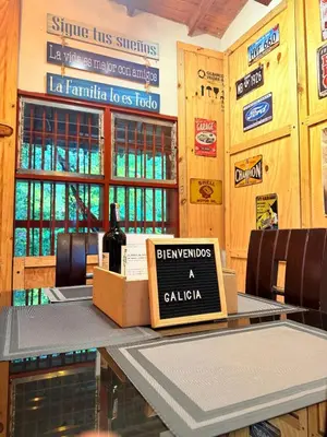 a bottle of wine on a table in a restaurant at Maravilla de cabaña grupal 5-10 personas parking, wifi, campestre, cercana in Jardin