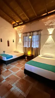 a bedroom with two beds in a room at Maravilla de cabaña grupal 5-10 personas parking, wifi, campestre, cercana in Jardin