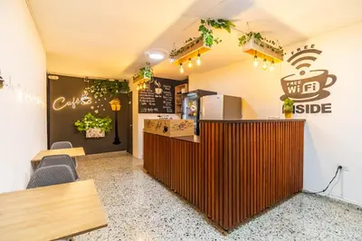 a fast food restaurant with a counter and chairs at Edificio SantaMarta Medellín in Medellín