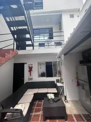 a living room with a couch and a table at Edificio SantaMarta Medellín in Medellín