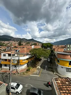 an aerial view of a city with a street at Amplio ApartaStudio en Boston in Medellín