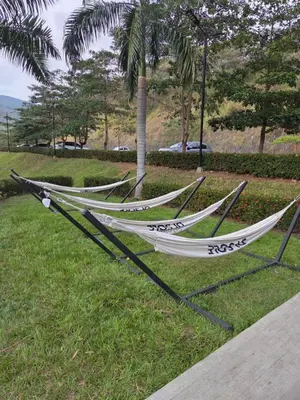 three hammocks on the grass in a park at Citadela Di Sole - Apartamento in Santa Fe de Antioquia