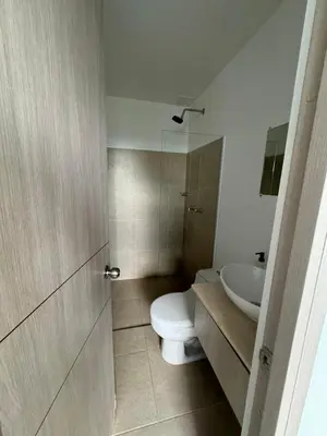 a bathroom with a toilet and a sink at Citadela Di Sole - Apartamento in Santa Fe de Antioquia