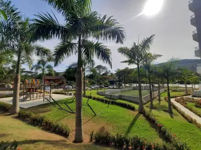a park with palm trees and a playground at Citadela Di Sole - Apartamento in Santa Fe de Antioquia