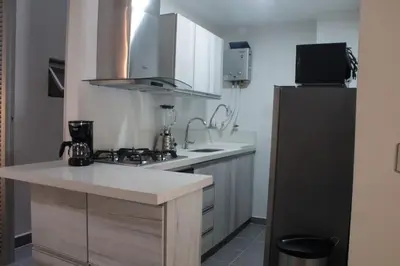 a kitchen with a sink and a counter top at Espectacular apartaestudio en sabaneta! in Sabaneta