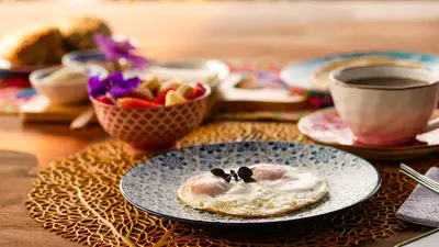 a table with a plate with a dessert on it at Tominejo Ecolodge - Casas en los árboles in Neira